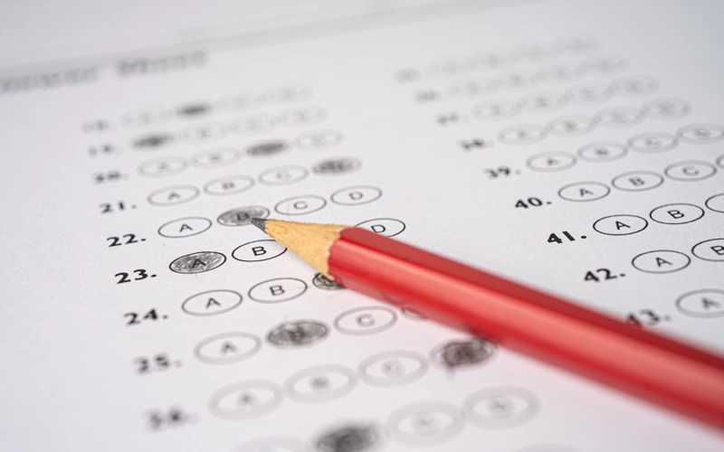 Quiz answer sheet with a pencil ready to mark an answer